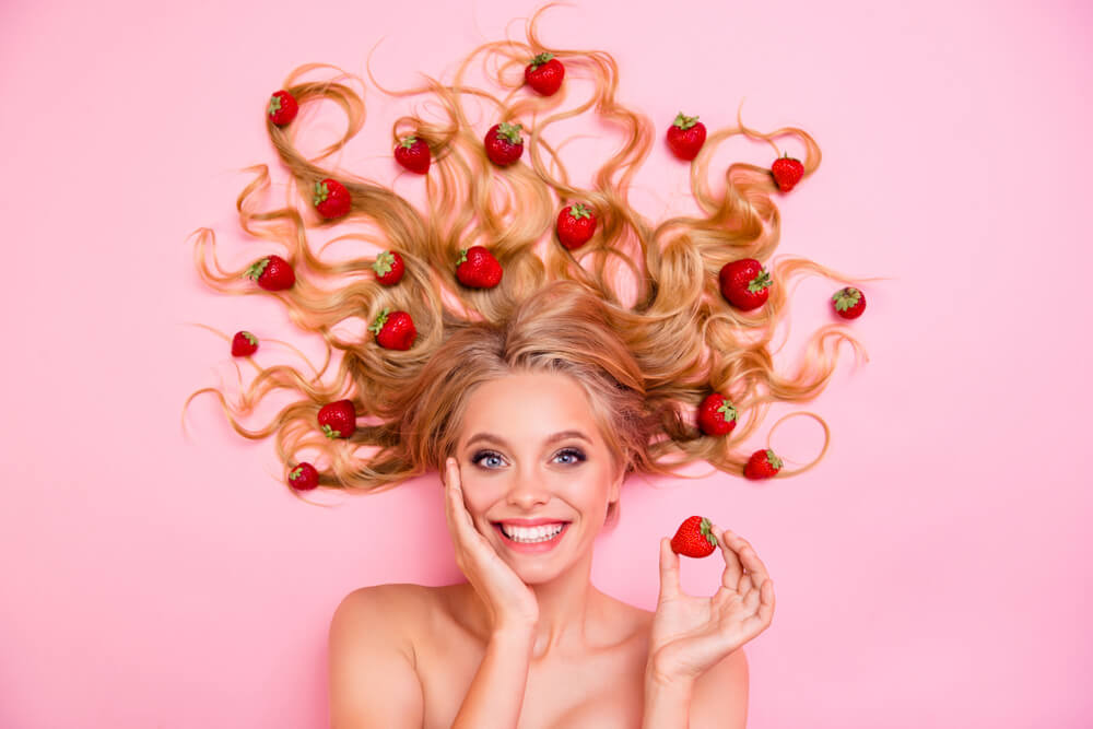 girl with a strawberries on her hair